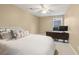 Bedroom featuring a comfortable bed, a desk area, and soft neutral tones at 400 Eagle Tiff Dr, Sugar Hill, GA 30518