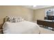 Cozy bedroom featuring a comfortable bed and dedicated workspace with a desk at 400 Eagle Tiff Dr, Sugar Hill, GA 30518