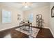 Bedroom with wood floors, neutral paint, and two windows offering natural light at 3395 Lake Valley Nw Rd, Atlanta, GA 30331