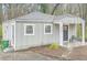 Charming single story home with a covered porch, gray siding, and a well-kept front yard at 3395 Lake Valley Nw Rd, Atlanta, GA 30331