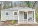 Charming single-story home featuring a cozy front porch and freshly painted exterior at 3395 Lake Valley Nw Rd, Atlanta, GA 30331