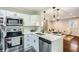 Beautiful updated kitchen featuring stainless steel appliances and white cabinetry at 3395 Lake Valley Nw Rd, Atlanta, GA 30331