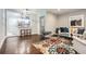 Open-concept living room features hardwood floors and a view of the breakfast bar at 3395 Lake Valley Nw Rd, Atlanta, GA 30331