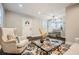 Warm and inviting living area with hardwood floors and views to the adjacent kitchen at 3395 Lake Valley Nw Rd, Atlanta, GA 30331