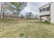 Grassy backyard with mature trees at 71 Farm St, Hiram, GA 30141
