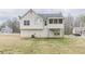 Back view of home with screened in deck and large backyard at 71 Farm St, Hiram, GA 30141
