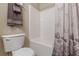Bathroom featuring a shower, commode, linen and toiletry storage and decorative accessories at 71 Farm St, Hiram, GA 30141