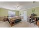 Spacious bedroom featuring a ceiling fan, soft decor, and carpeted floors at 71 Farm St, Hiram, GA 30141