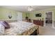 Spacious bedroom featuring carpeted floors, ceiling fan, and soft lighting at 71 Farm St, Hiram, GA 30141