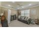 Bonus room featuring large windows, plush carpet, crown molding and a ceiling fan at 71 Farm St, Hiram, GA 30141