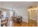 Light-filled dining area featuring wood floors, charming wainscoting, and a stylish light fixture at 71 Farm St, Hiram, GA 30141
