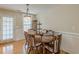 Comfortable dining room with a round table and wood floors, perfect for Gathering meals at 71 Farm St, Hiram, GA 30141