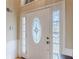 Elegant entryway with a decorative glass front door, sidelights, and fresh paint at 71 Farm St, Hiram, GA 30141
