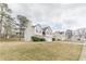 Inviting home exterior with a spacious lawn, mature trees, and a classic suburban feel at 71 Farm St, Hiram, GA 30141