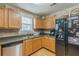 Efficient kitchen layout with stainless steel appliances, plentiful cabinet space, and durable countertops at 71 Farm St, Hiram, GA 30141