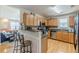 Well-appointed kitchen with stainless steel appliances, granite countertops, and breakfast bar seating at 71 Farm St, Hiram, GA 30141