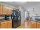 Well-lit kitchen featuring stainless steel appliances and hardwood flooring at 71 Farm St, Hiram, GA 30141