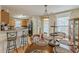Open-concept kitchen and dining area with modern appliances and a stylish breakfast bar at 71 Farm St, Hiram, GA 30141
