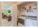Neat laundry room with washer, dryer, and storage shelves at 71 Farm St, Hiram, GA 30141