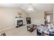 Cozy living room featuring a fireplace, ceiling fan, and neutral decor at 71 Farm St, Hiram, GA 30141