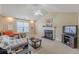 Light-filled living room featuring a fireplace, high ceilings, and neutral carpeting at 71 Farm St, Hiram, GA 30141
