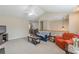 Inviting living room with vaulted ceilings, plush carpeting, and views into the dining room at 71 Farm St, Hiram, GA 30141