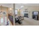 Light-filled living room featuring a fireplace, high ceilings, and a view of the entryway at 71 Farm St, Hiram, GA 30141