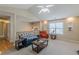 Cozy living room featuring a vaulted ceiling, a view of the upstairs railing, and neutral carpeting at 71 Farm St, Hiram, GA 30141