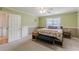Bright main bedroom with a ceiling fan and two toned walls at 71 Farm St, Hiram, GA 30141