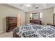 Main bedroom featuring a tray ceiling and dark wood furniture at 71 Farm St, Hiram, GA 30141