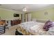Spacious main bedroom featuring green walls, a ceiling fan, and carpet flooring at 71 Farm St, Hiram, GA 30141