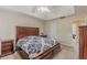 Main bedroom featuring a tray ceiling and dark wood furniture at 71 Farm St, Hiram, GA 30141