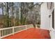 Painted back deck overlooking a wooded backyard at 727 Vinings Estates Se Dr, Mableton, GA 30126