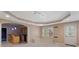 Finished basement area with a built-in bar, seating, and an exterior door at 727 Vinings Estates Se Dr, Mableton, GA 30126