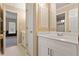 Bright bathroom featuring a vanity with a white countertop and ample storage space at 727 Vinings Estates Se Dr, Mableton, GA 30126