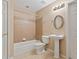 Traditional bathroom featuring tiled shower/tub combo and pedestal sink at 727 Vinings Estates Se Dr, Mableton, GA 30126
