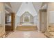 This primary bathroom has tile floors, a glass shower, and a soaking tub at 727 Vinings Estates Se Dr, Mableton, GA 30126