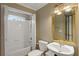 Cozy bathroom with tiled shower-tub combo, vanity, and fixtures at 727 Vinings Estates Se Dr, Mableton, GA 30126
