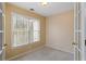 This is a standard bedroom with tan paint and natural light from a double window at 727 Vinings Estates Se Dr, Mableton, GA 30126