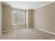 Neutral bedroom with large window and soft carpet at 727 Vinings Estates Se Dr, Mableton, GA 30126