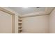 Empty bonus room featuring built-in shelving and neutral colored walls at 727 Vinings Estates Se Dr, Mableton, GA 30126