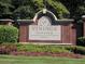 A welcoming Vinings Estates community sign amidst manicured landscaping and lush greenery at 727 Vinings Estates Se Dr, Mableton, GA 30126