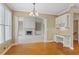 Open dining room with built-in desk and view into the living room with fireplace at 727 Vinings Estates Se Dr, Mableton, GA 30126