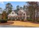 Beautiful two-story brick home featuring manicured landscaping and a well-maintained lawn at 727 Vinings Estates Se Dr, Mableton, GA 30126