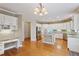 A well-lit kitchen with stainless steel appliances, granite countertops, and an island at 727 Vinings Estates Se Dr, Mableton, GA 30126
