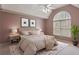 Main bedroom showcasing a vaulted ceiling, arched window, and soothing color palette at 727 Vinings Estates Se Dr, Mableton, GA 30126
