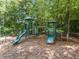 Community playground featuring multiple slides, climbing structures, and benches at 727 Vinings Estates Se Dr, Mableton, GA 30126