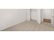 Bedroom featuring neutral carpet, closet and entry doors, and freshly painted walls at 13224 Tolstoy, Covington, GA 30014