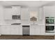 Modern kitchen featuring white cabinets, stainless steel appliances, and double ovens at 13224 Tolstoy, Covington, GA 30014