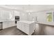 Modern kitchen with white cabinets, stainless steel appliances, and a center island at 13224 Tolstoy, Covington, GA 30014
